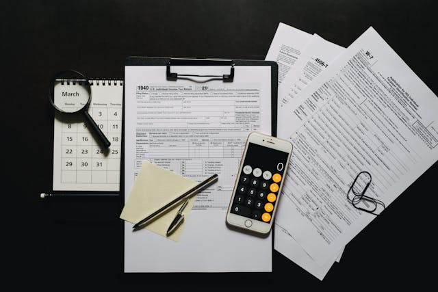 Smartphone on a Clipboard with Blank Tax Forms