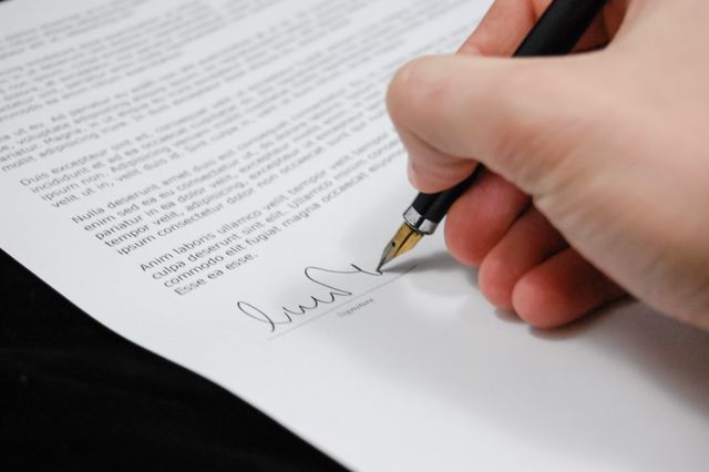 a tenant signing a lease agreement